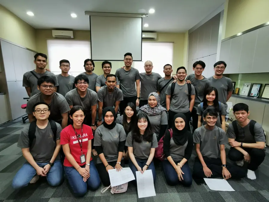 Advisory Apps engineering team group photo in the Kuala Lumpur office meeting room