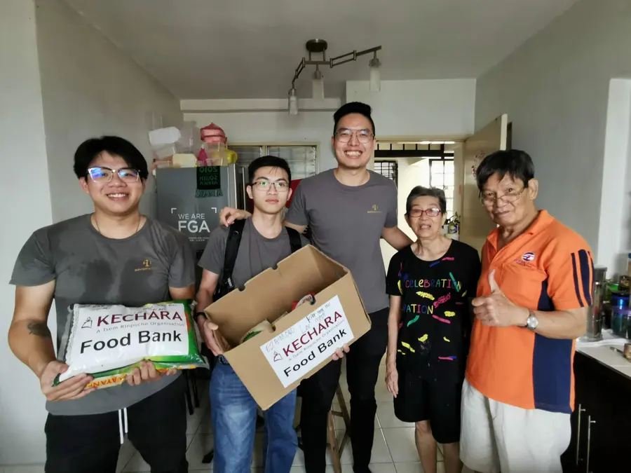 Advisory Apps team delivering Kechara Food Bank donations to a community home