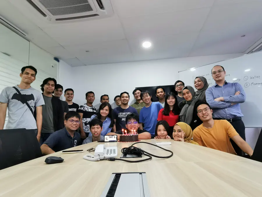 Advisory Apps team celebrating a birthday in the office boardroom